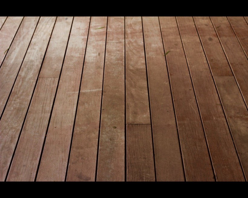 Hardwood deck boards with even gaps running the length of the deck